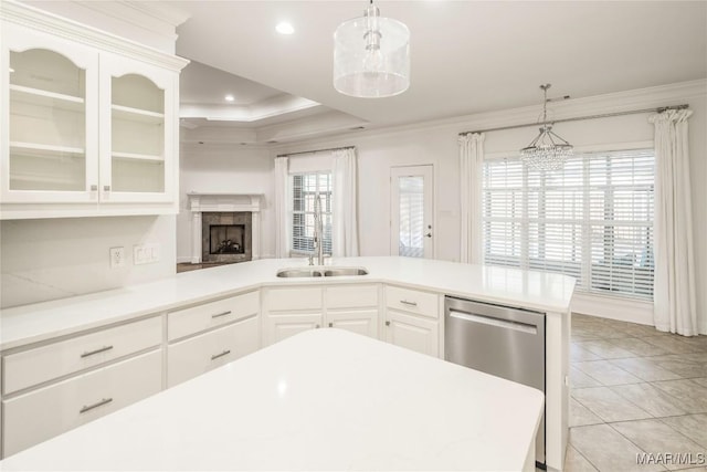 1580 W Overbrook Rd, Millbrook, AL 36054 - kitchen featuring a sink, crown molding, light countertops, glass insert cabinets, and stainless steel dishwasher
