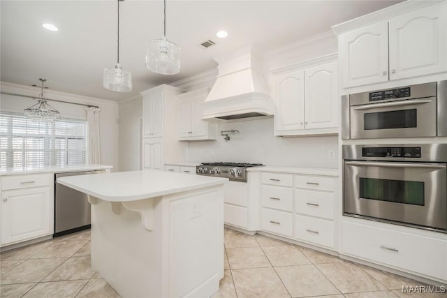1580 W Overbrook Rd, Millbrook, AL 36054 - kitchen featuring stainless steel appliances, visible vents, light countertops, light tile patterned flooring, and custom range hood