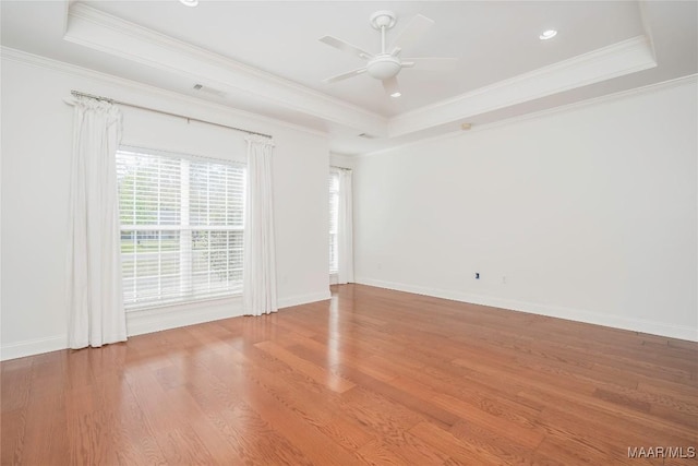 1580 W Overbrook Rd, Millbrook, AL 36054 - spare room with wood finished floors, visible vents, crown molding, a ceiling fan, and a raised ceiling