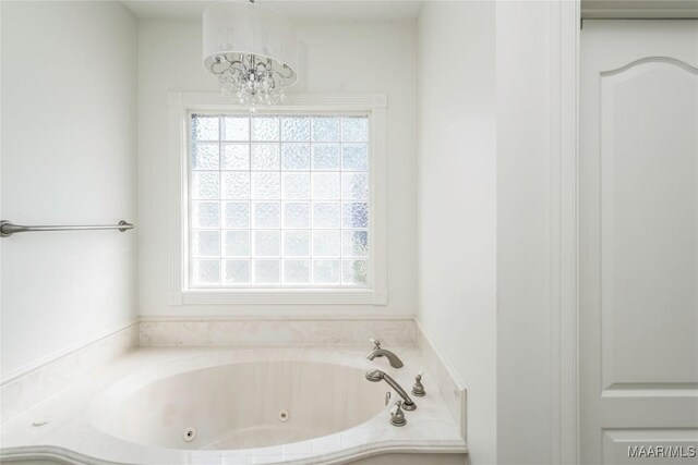 1580 W Overbrook Rd, Millbrook, AL 36054 - full bath featuring an inviting chandelier and a whirlpool tub
