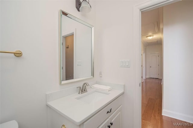 1580 W Overbrook Rd, Millbrook, AL 36054 - bathroom featuring vanity, toilet, baseboards, and wood finished floors