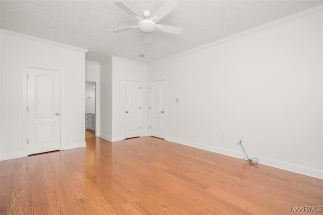 1580 W Overbrook Rd, Millbrook, AL 36054 - interior space with a textured ceiling, ensuite bath, crown molding, baseboards, and light wood-style floors
