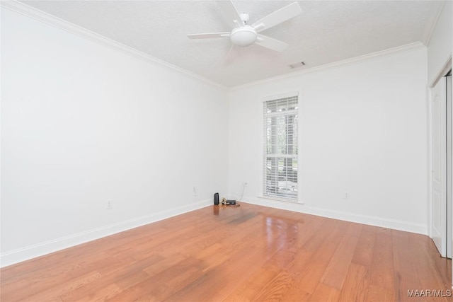 1580 W Overbrook Rd, Millbrook, AL 36054 - empty room featuring baseboards, crown molding, and wood finished floors
