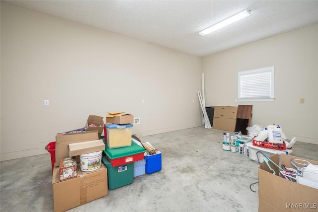 1580 W Overbrook Rd, Millbrook, AL 36054 - miscellaneous room with a textured ceiling and concrete flooring