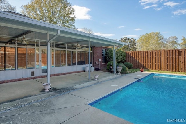 1580 W Overbrook Rd, Millbrook, AL 36054 - view of swimming pool with a ceiling fan, a fenced in pool, a patio, a sunroom, and a fenced backyard