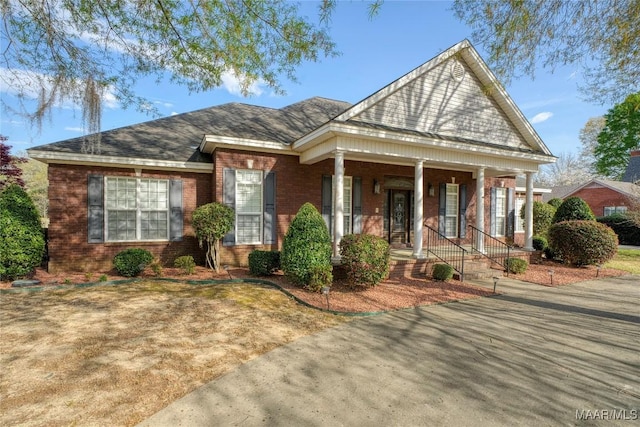 1580 W Overbrook Rd, Millbrook, AL 36054 - view of front of property featuring covered porch and brick siding