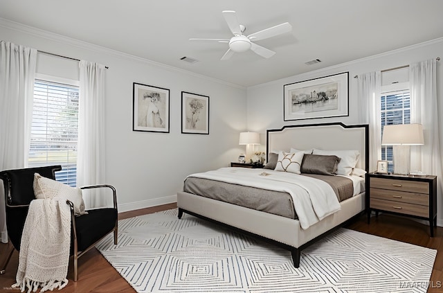 1580 W Overbrook Rd, Millbrook, AL 36054 - bedroom with a ceiling fan, visible vents, dark wood-style flooring, baseboards, and ornamental molding