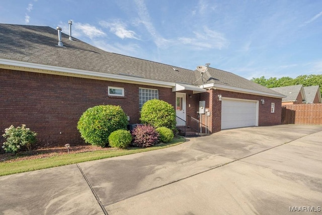 1580 W Overbrook Rd, Millbrook, AL 36054 - single story home featuring fence, brick siding, driveway, a garage, and a shingled roof