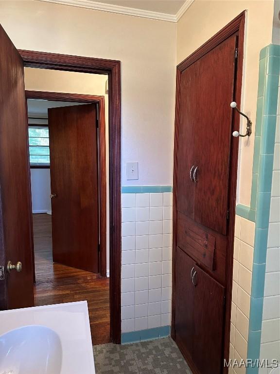 125 Butler St, Selma, AL 36701 - interior space featuring tile walls, wainscoting, and ornamental molding