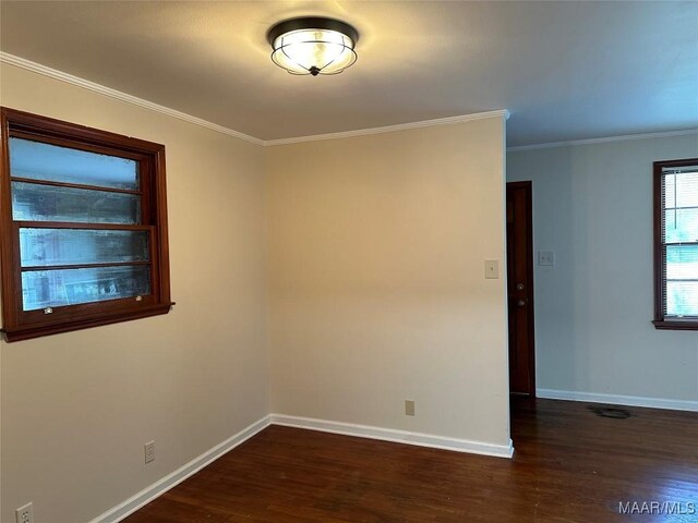 125 Butler St, Selma, AL 36701 - unfurnished room featuring crown molding, dark wood-style flooring, and baseboards
