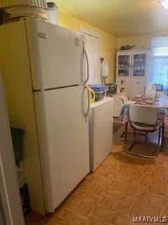 kitchen featuring freestanding refrigerator