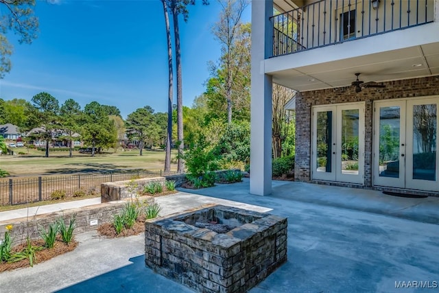 9533 Fendall Hall Cir, Montgomery, AL 36117 - view of patio with french doors, a ceiling fan, an outdoor fire pit, fence, and a balcony