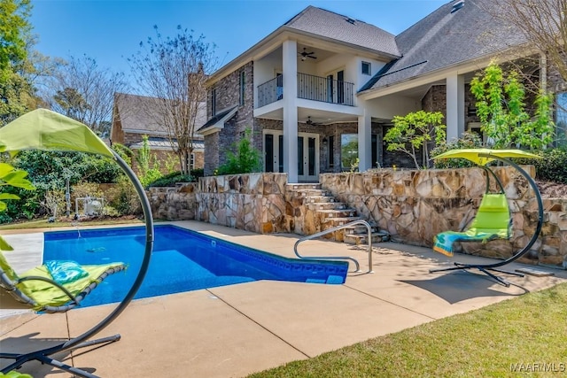 9533 Fendall Hall Cir, Montgomery, AL 36117 - outdoor pool with stairway, ceiling fan, french doors, and a patio