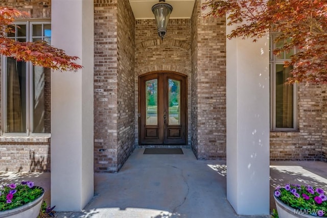 9533 Fendall Hall Cir, Montgomery, AL 36117 - doorway to property with french doors and brick siding