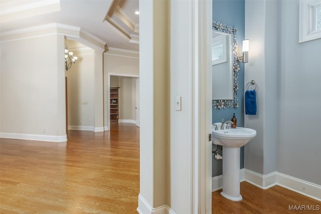 9533 Fendall Hall Cir, Montgomery, AL 36117 - bathroom featuring baseboards, ornamental molding, wood finished floors, and a chandelier