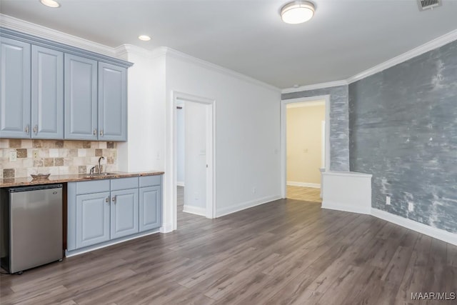 9533 Fendall Hall Cir, Montgomery, AL 36117 - kitchen featuring stainless steel dishwasher, ornamental molding, a sink, and dark wood-type flooring