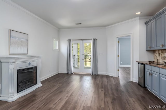 9533 Fendall Hall Cir, Montgomery, AL 36117 - unfurnished living room featuring a fireplace, ornamental molding, french doors, and dark wood-style flooring