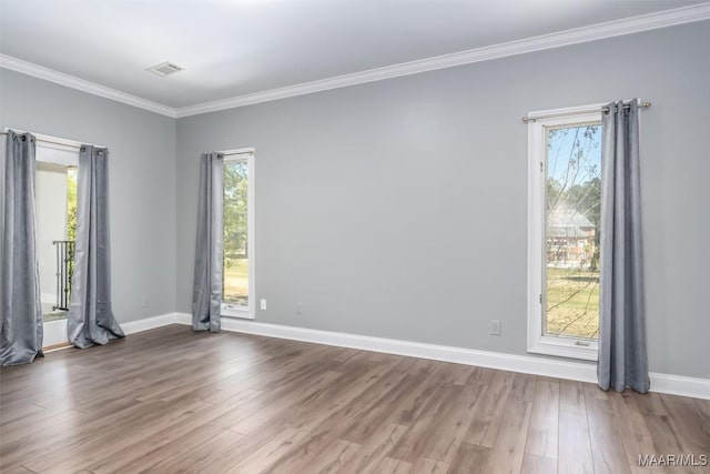 9533 Fendall Hall Cir, Montgomery, AL 36117 - unfurnished room featuring wood finished floors, ornamental molding, baseboards, and visible vents
