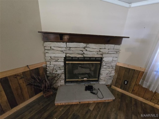 interior details featuring crown molding and wood finished floors