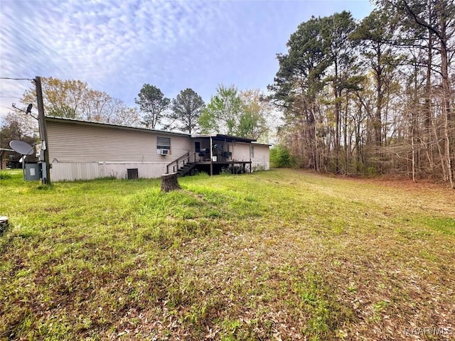 9100 Grier Rd, Wetumpka, AL 36092 - view of grassy yard with a deck and stairway