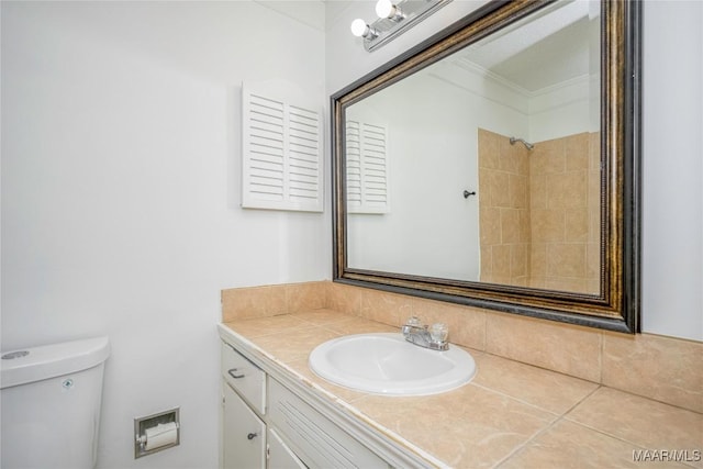 bathroom with toilet and vanity