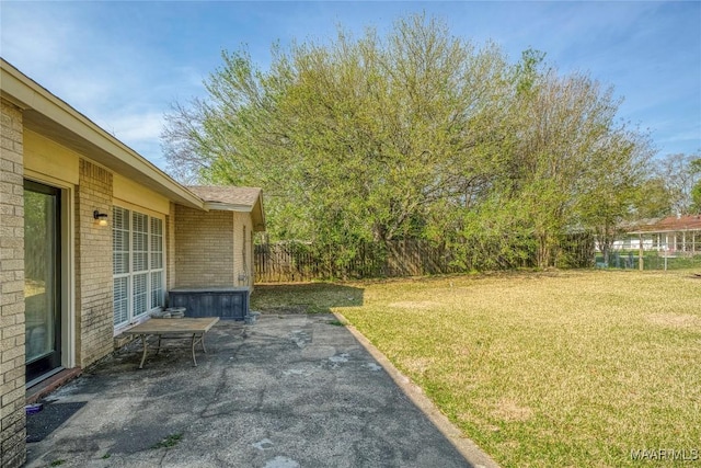 view of yard with a patio and fence