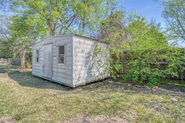 view of shed with a fenced backyard