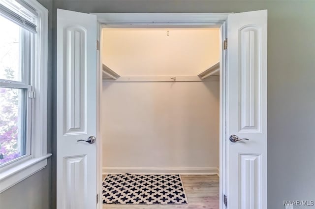 spacious closet with light wood finished floors