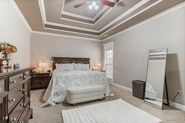bedroom with ceiling fan, light colored carpet, a raised ceiling, baseboards, and ornamental molding