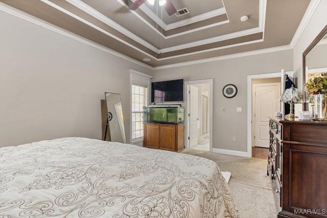 bedroom with a ceiling fan, visible vents, a raised ceiling, baseboards, and light carpet