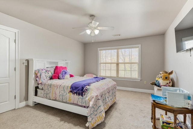 carpeted bedroom with a ceiling fan, baseboards, and visible vents