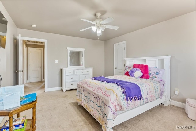 bedroom featuring baseboards, ceiling fan, and light colored carpet
