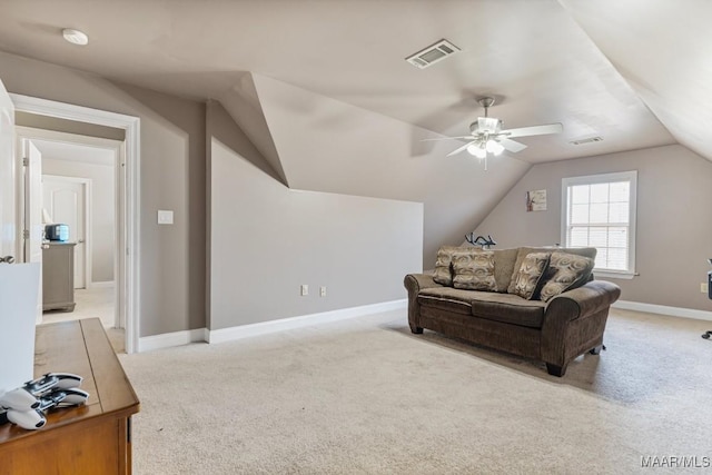 living room with visible vents, a ceiling fan, lofted ceiling, and light colored carpet