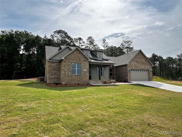 228 Mountain Laurel Rdg, Wetumpka, AL 36093 - craftsman-style house featuring brick siding, driveway, a front lawn, and a garage