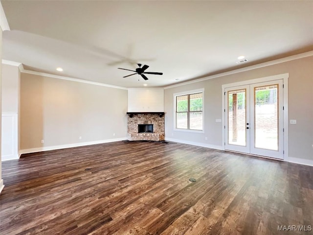 228 Mountain Laurel Rdg, Wetumpka, AL 36093 - unfurnished living room featuring dark wood finished floors, crown molding, and a ceiling fan