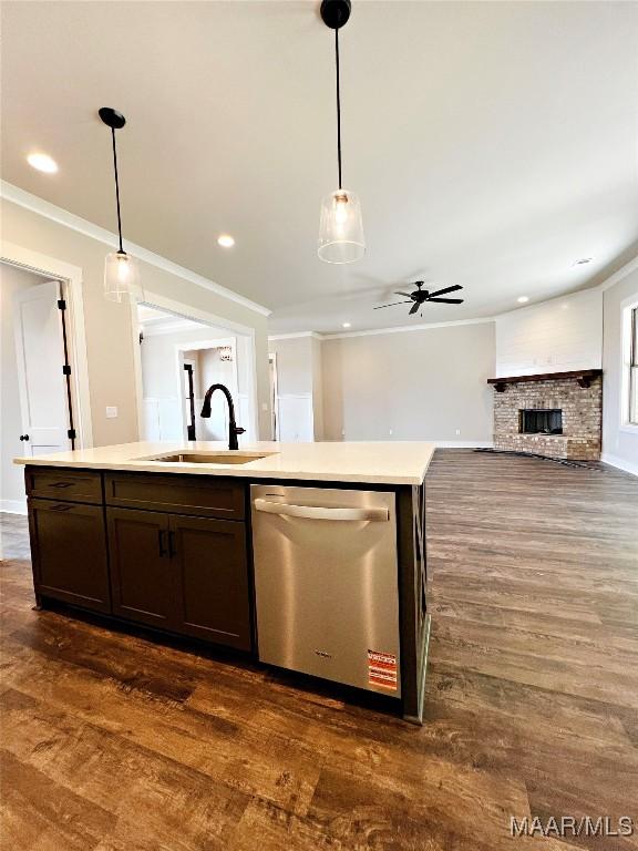 228 Mountain Laurel Rdg, Wetumpka, AL 36093 - kitchen featuring a sink, dark wood finished floors, dark brown cabinets, crown molding, and dishwasher