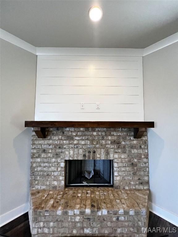 228 Mountain Laurel Rdg, Wetumpka, AL 36093 - room details with a fireplace, wood finished floors, and baseboards