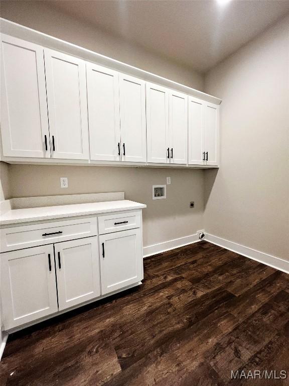 228 Mountain Laurel Rdg, Wetumpka, AL 36093 - laundry area with baseboards, cabinet space, dark wood-style floors, and washer hookup