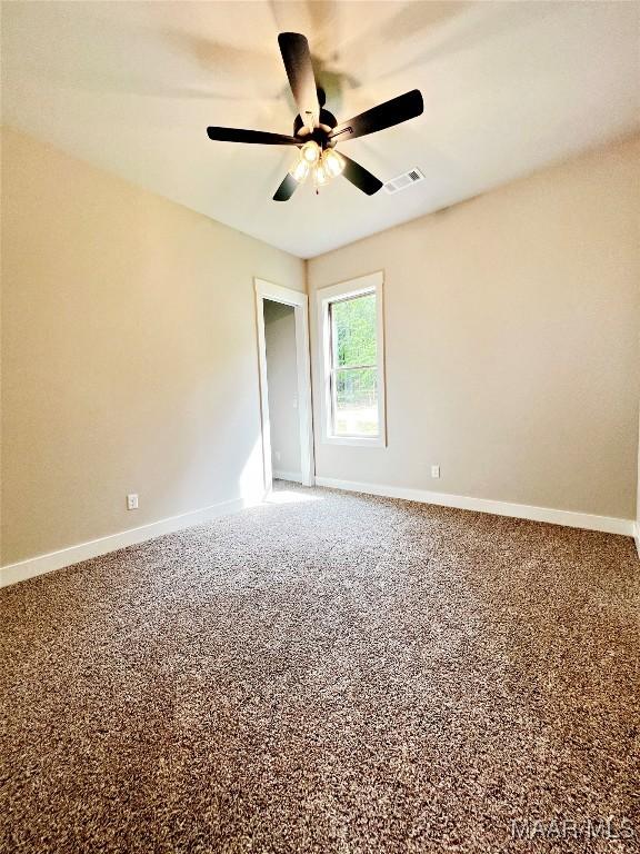 228 Mountain Laurel Rdg, Wetumpka, AL 36093 - spare room featuring a ceiling fan, baseboards, and carpet flooring