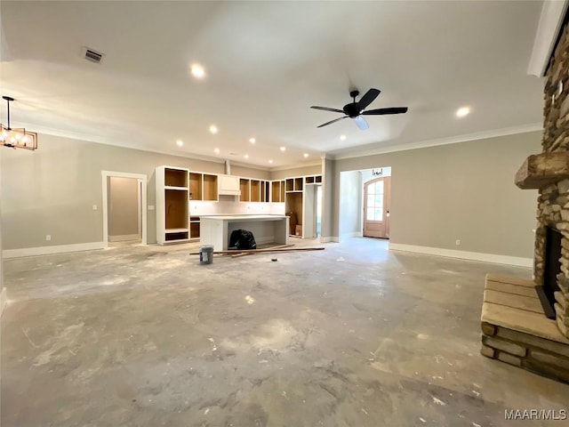 1150 Southern Hills Dr, Wetumpka, AL 36093 - unfurnished living room featuring crown molding, concrete floors, a fireplace with raised hearth, recessed lighting, and a ceiling fan
