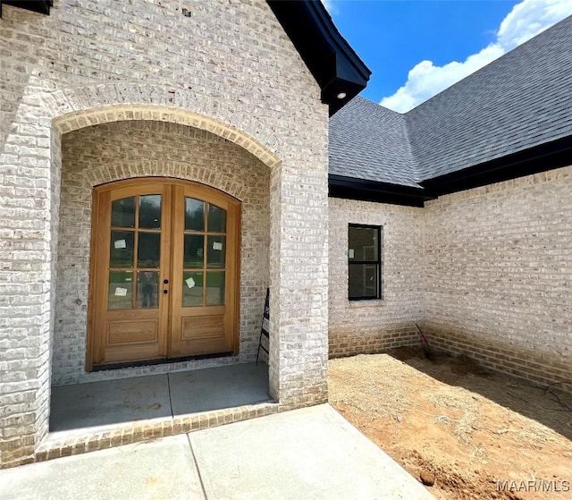 1150 Southern Hills Dr, Wetumpka, AL 36093 - entrance to property featuring french doors, roof with shingles, and brick siding
