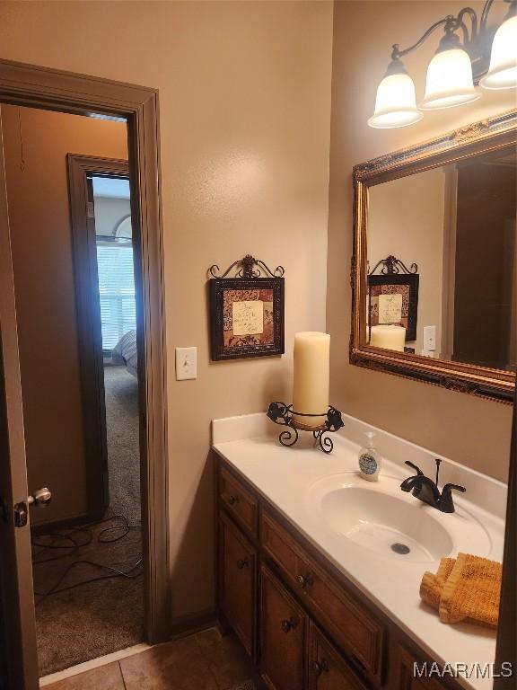 103 Rushmore Ct, Deatsville, AL 36022 - bathroom featuring tile patterned floors and vanity