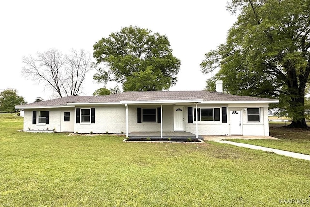 ranch-style house with a front lawn