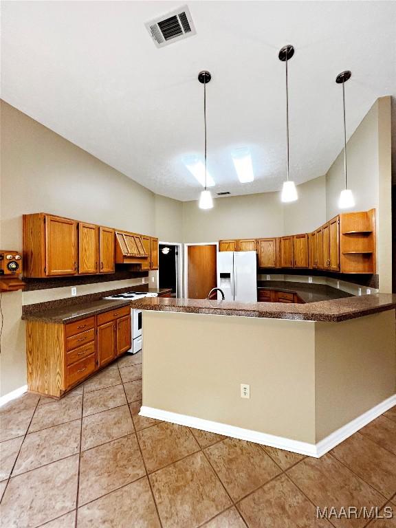 kitchen with decorative light fixtures, open shelves, white appliances, visible vents, and brown cabinets