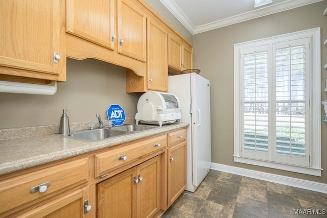 2714 County Road 54, Ozark, AL 36360 - kitchen with light countertops, crown molding, stone finish flooring, baseboards, and a sink