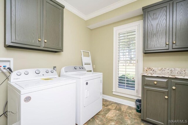 2714 County Road 54, Ozark, AL 36360 - laundry area featuring crown molding, baseboards, washer and dryer, and cabinet space