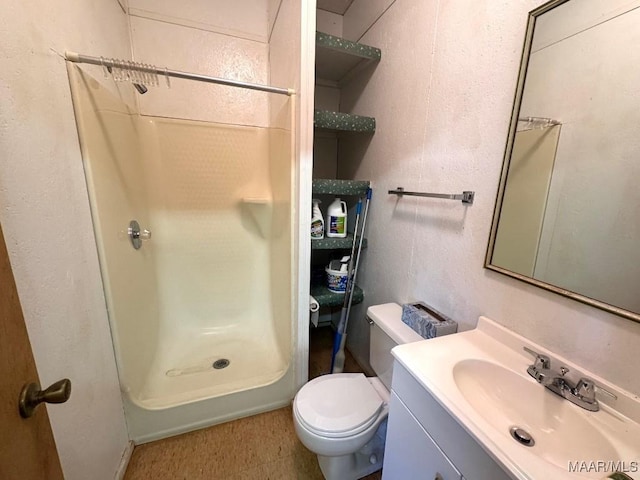 2714 County Road 54, Ozark, AL 36360 - bathroom with toilet, vanity, and a shower stall