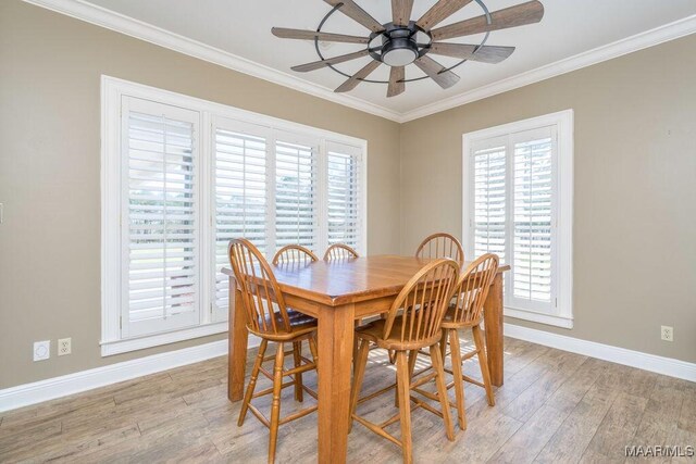 2714 County Road 54, Ozark, AL 36360 - dining room with baseboards, ornamental molding, light wood-style flooring, and a ceiling fan