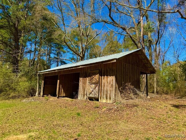 2714 County Road 54, Ozark, AL 36360 - view of pole building with a carport
