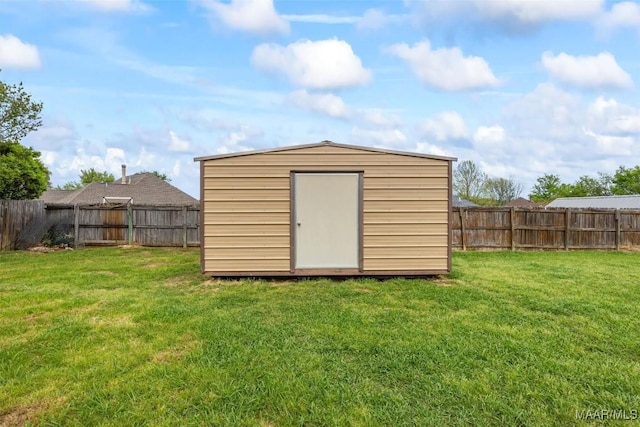 view of shed with a fenced backyard
